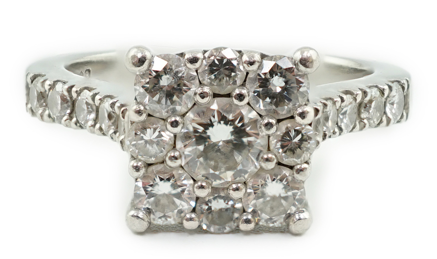 A modern platinum and nine stone diamond set square cluster ring